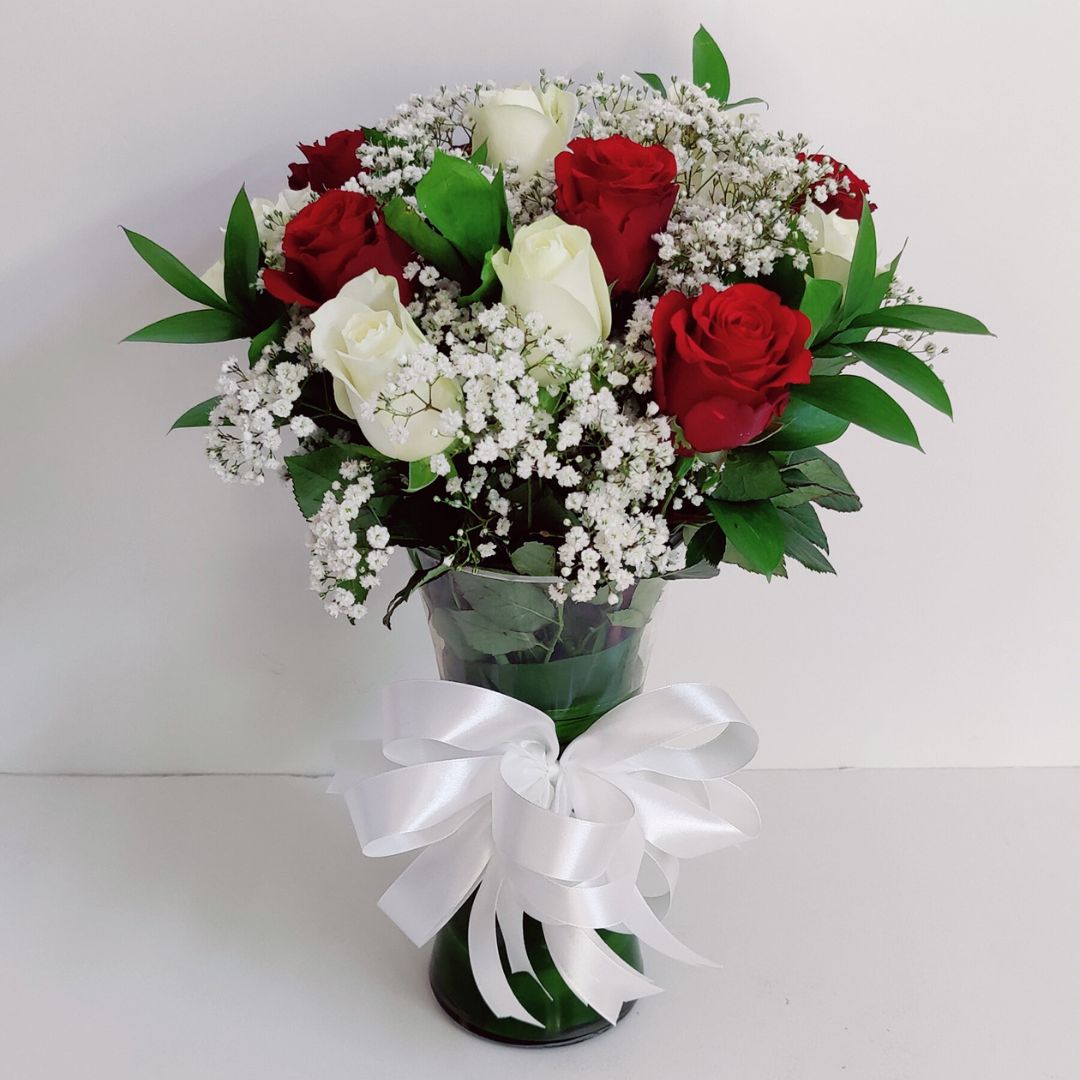 vase of white red roses