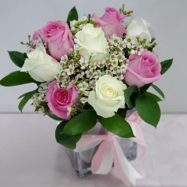 11 pink white roses vase