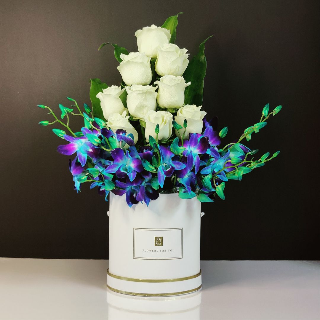 white roses blue orchids box